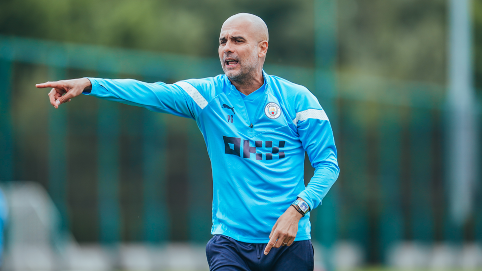 THE BOSS : Pep Guardiola gets his point across to the City players