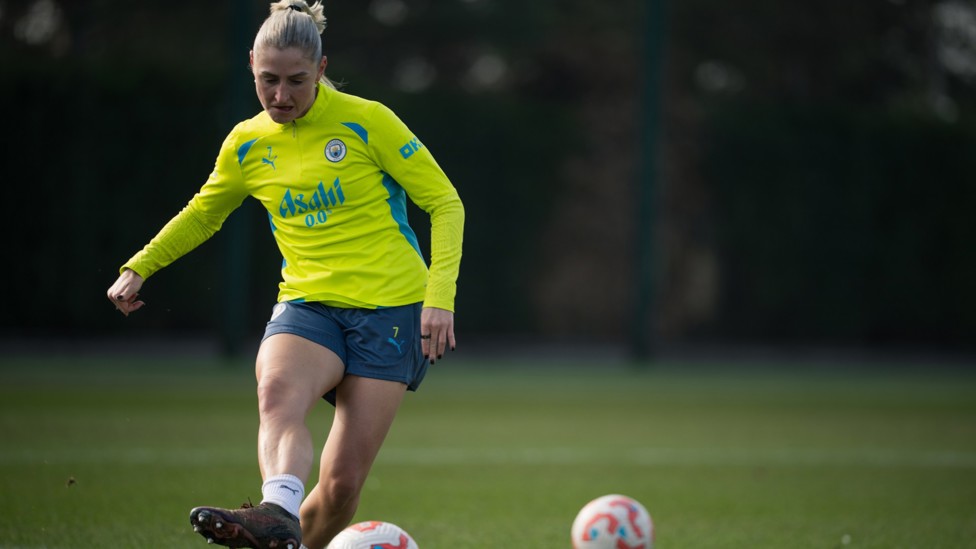 BACK AT BASE  : Laura Coombs strikes the ball.