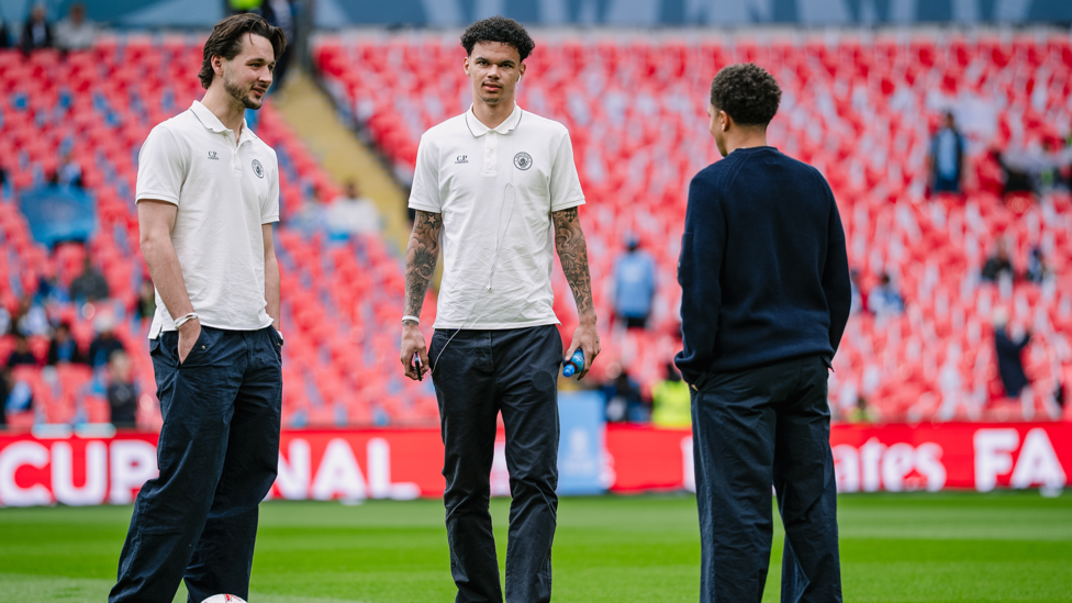 ACADEMY GRADUATES : Trafford, O'Reilly and Lewis take a pre-match stroll on the pitch.