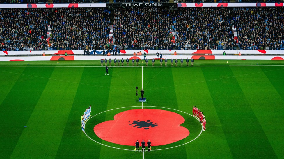 WE WILL REMEMBER THEM : The players and fans observe a period of silence to remember those who served and gave the ultimate sacrifice on our behalf. 
