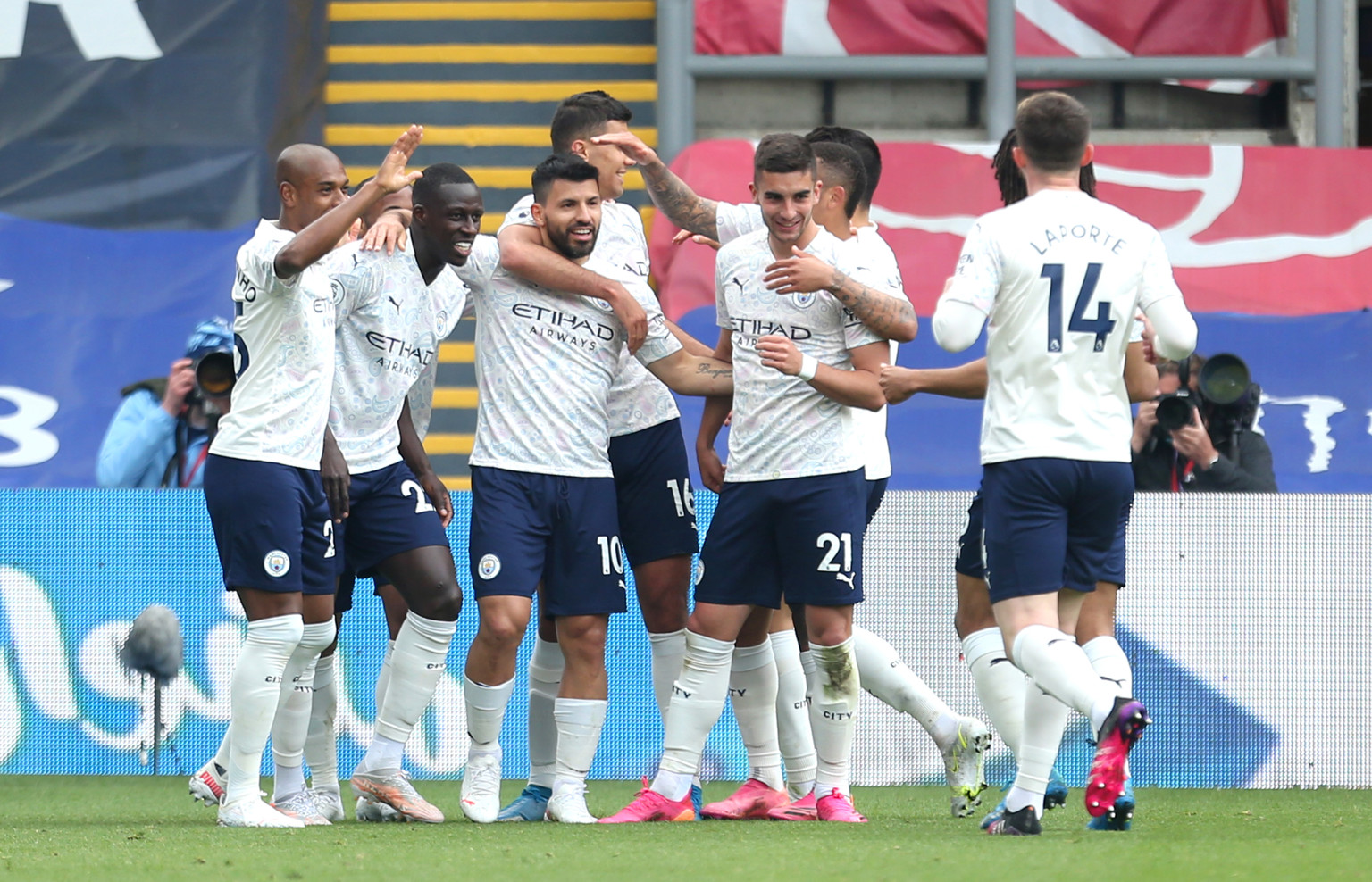 The City team congratulate Sergio Aguero on his super strike