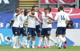 The City team congratulate Sergio Aguero on his super strike