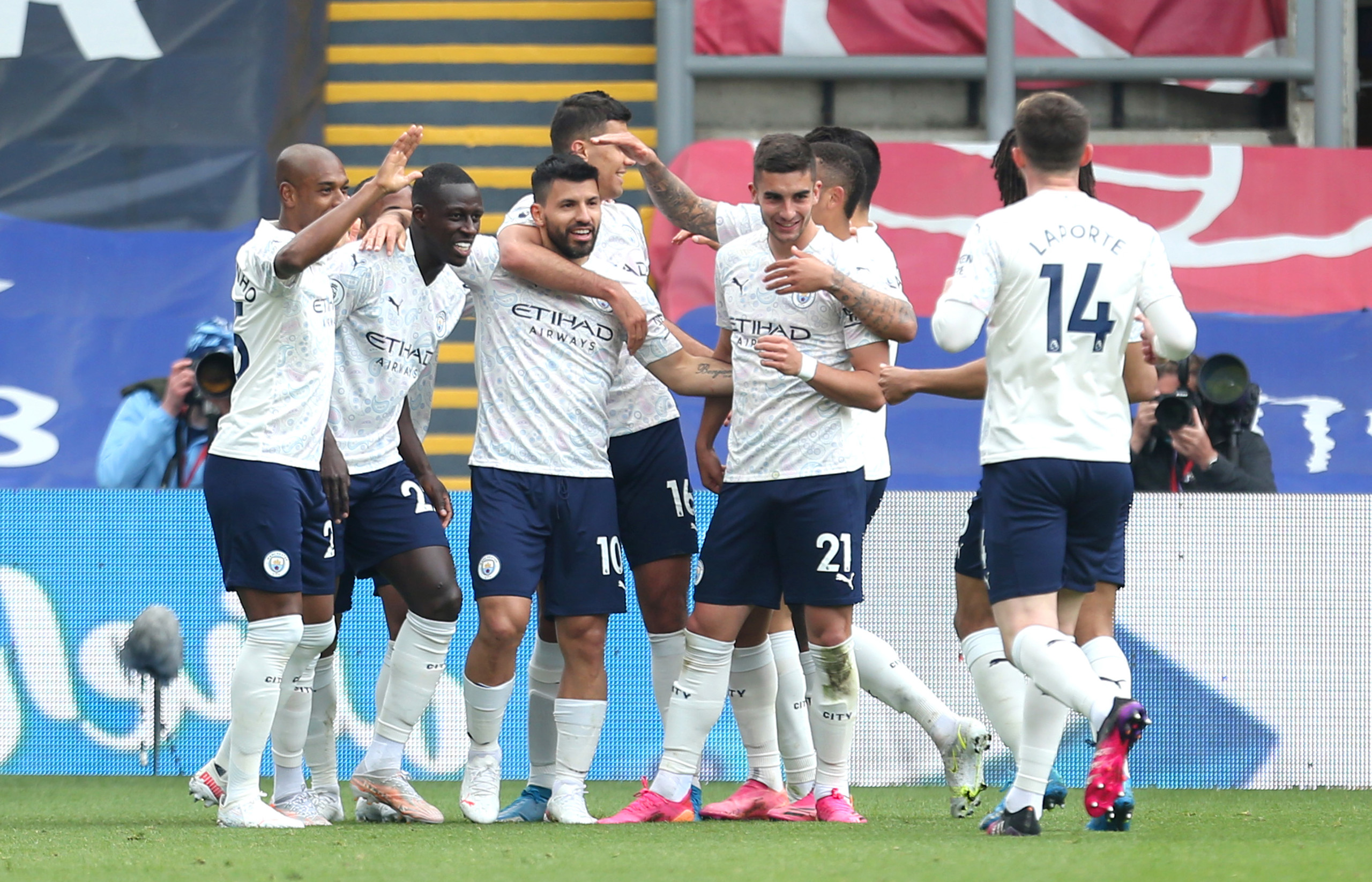 The City team congratulate Sergio Aguero on his super strike