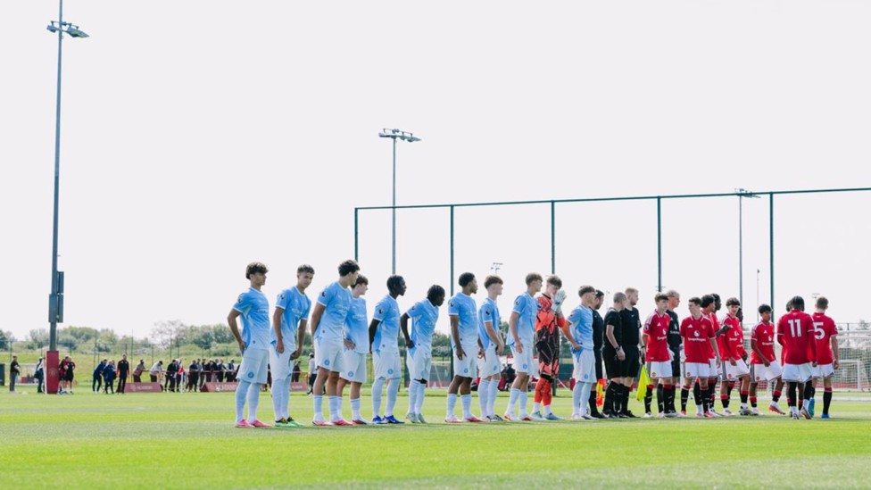 TAKING TO THE PITCH : City and United head out onto the pitch. 