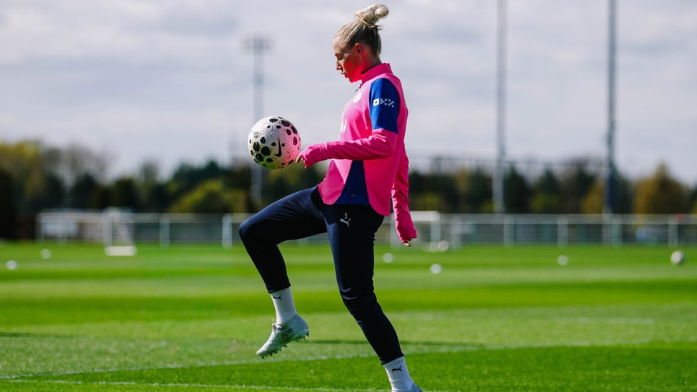 KNEES UP  : Greenwood has the ball under her spell. 