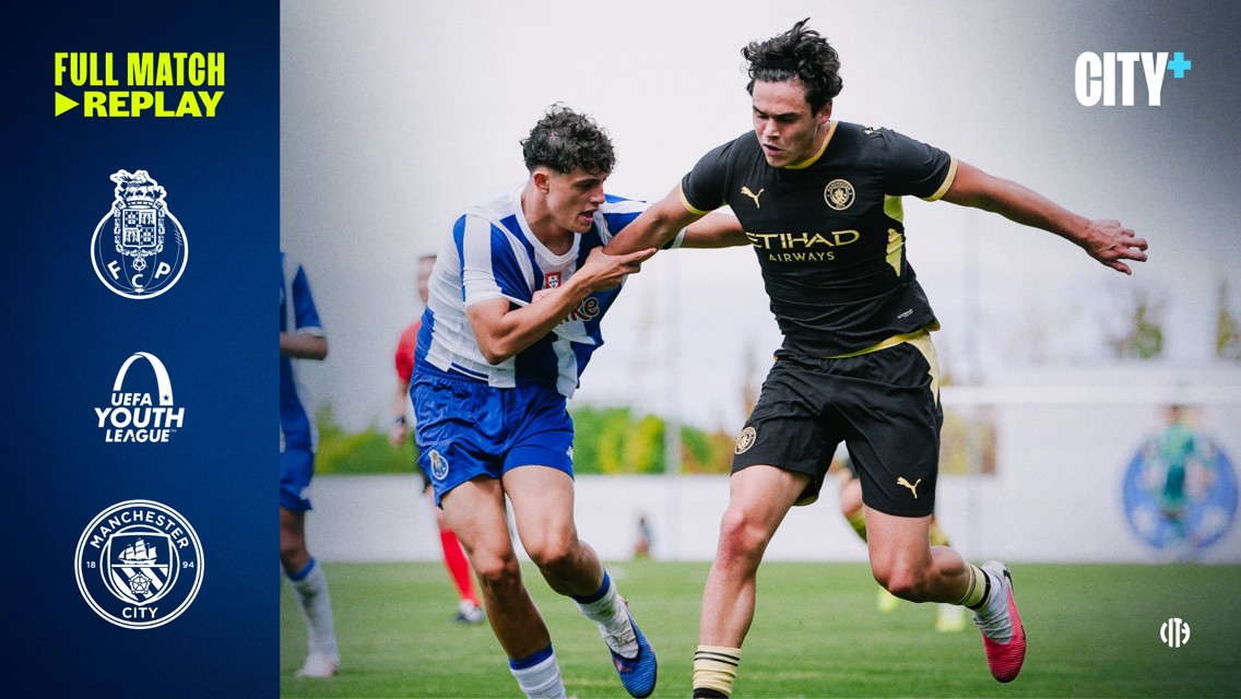 Two players in action during a UEFA Youth League match. The left wears FC Porto's blue and white kit, while the right wears Manchester City's black kit. UEFA Youth League and team logos are on the left.
