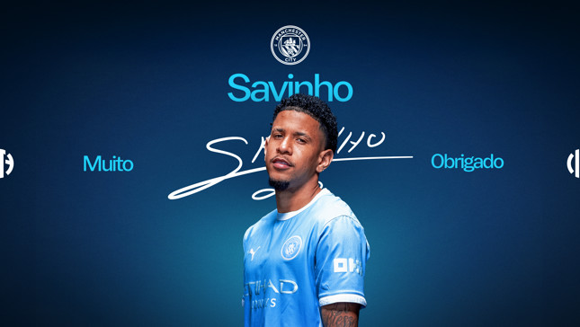 Image featuring a person in a Manchester City jersey with the text 'Muito Obrigado Savinho' and the club's logo.