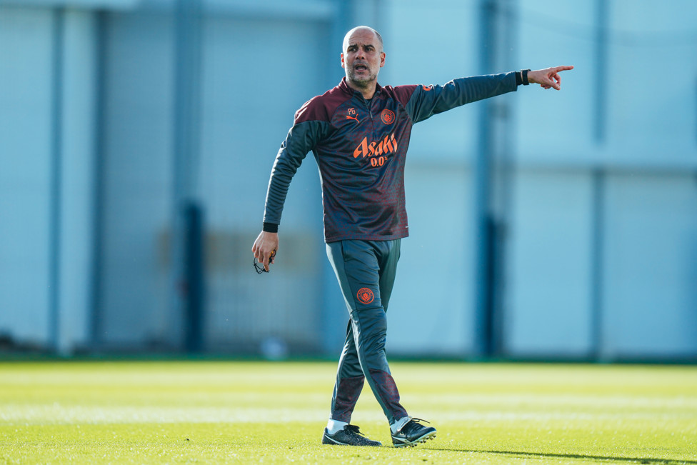 THE BOSS : Pep Guardiola offers out instructions.