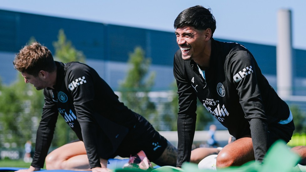FUN IN THE SUN : Tijjani Reijnders and John Stones also enjoying the yoga. 