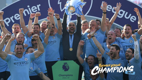 CHAMPIONS: Pep Guardiola lifts the trophy aloft.