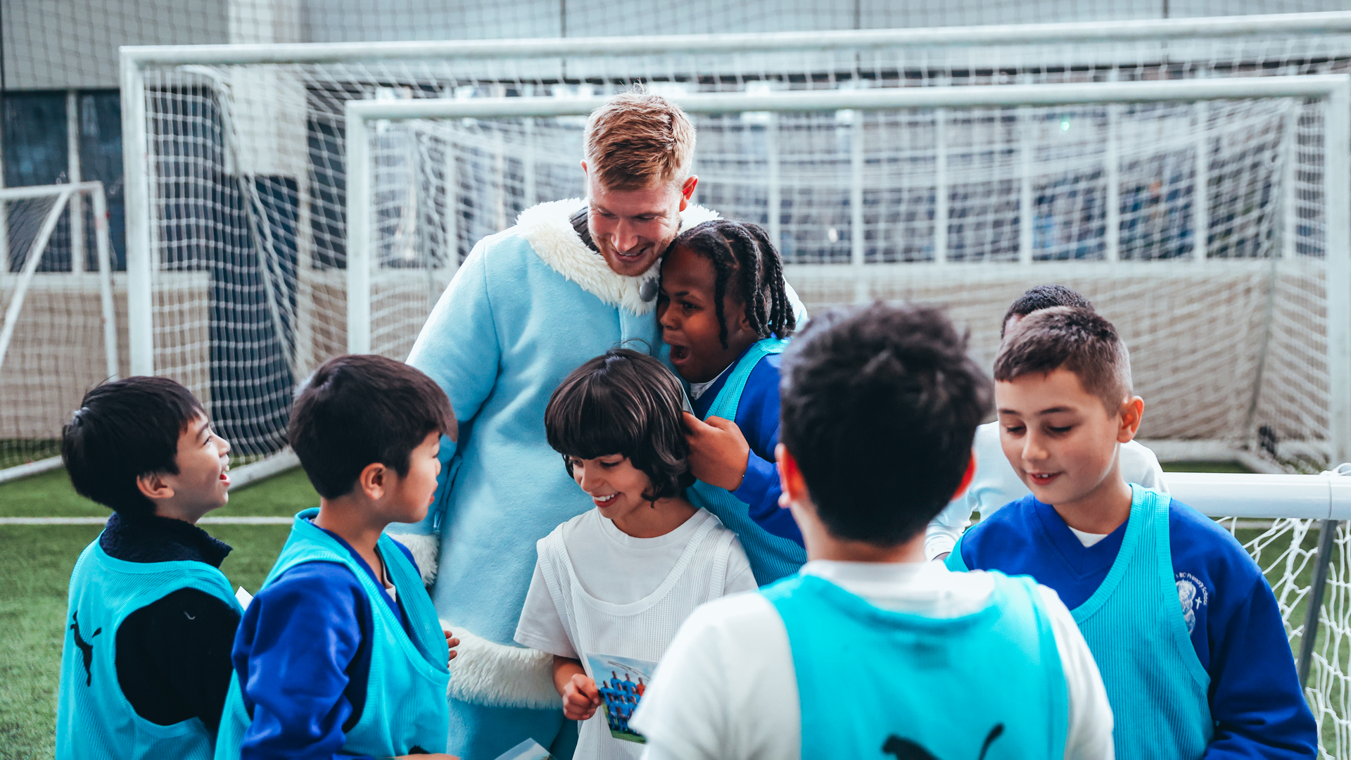 SPREADING JOY : KDB is revealed as City Santa Claus as he meets CITC participants from Our Lady’s RC Primary School in Whalley Range.