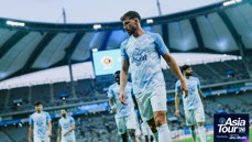 Manchester City players wearing blue cloud-themed jerseys during the Asia Tour '26 at a stadium in Seoul. The event is powered by Abu Dhabi.