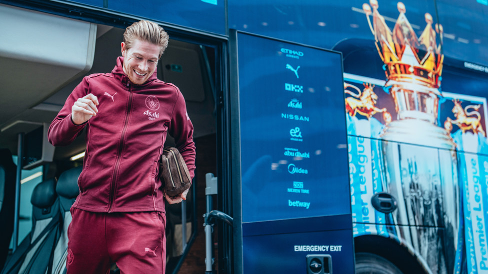 BEAMING BELGIAN : KDB steps off the team bus in great spirits.