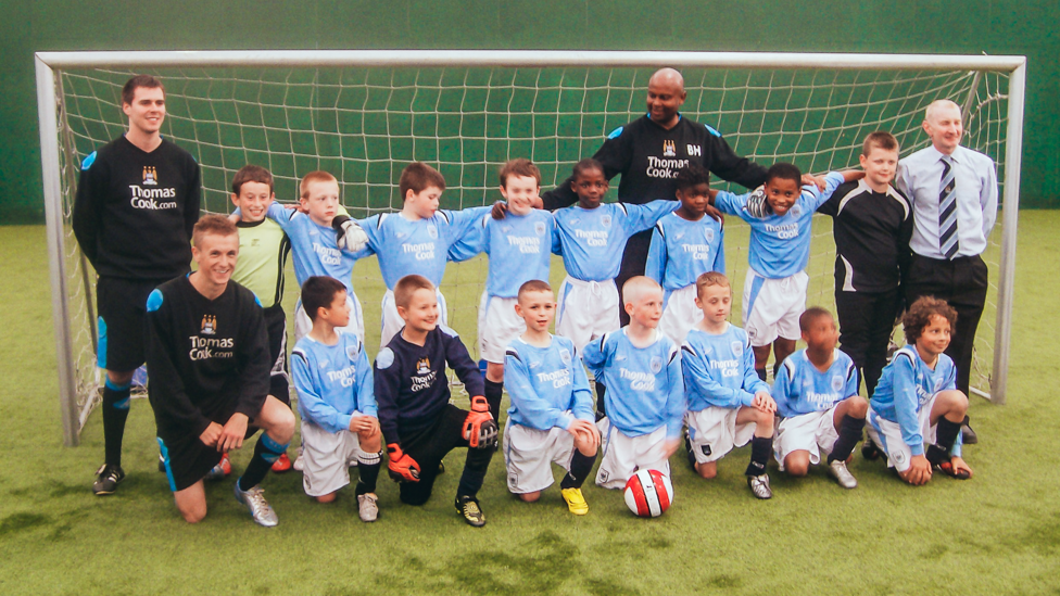 A STAR IS BORN : Foden poses with his former youth team ready to embark on his City journey.  