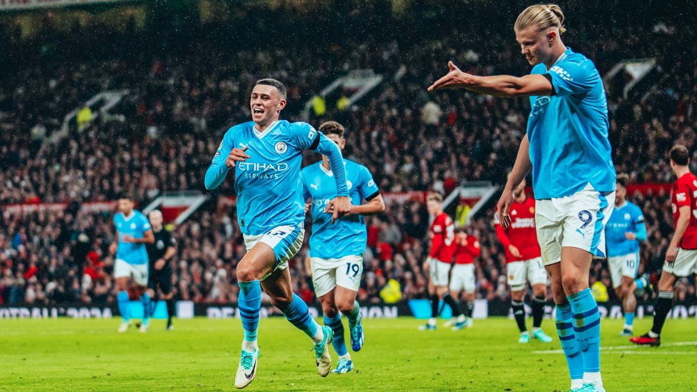 TAKE THE STAGE : Haaland shows Foden the way after the latter's goal at Old Trafford