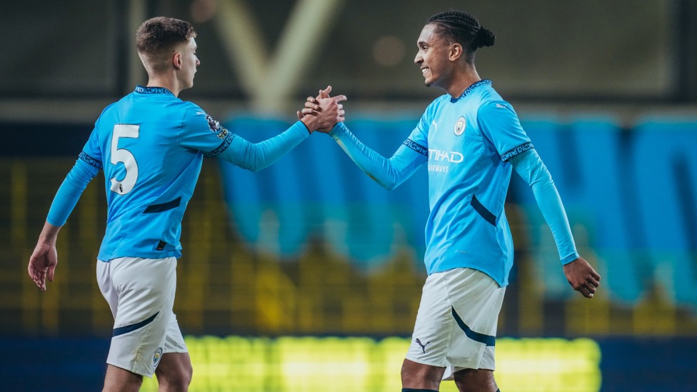 DEFENSIVE DUO : Seb Naylor and Lakyle Samuel high five after City's PL2 draw with Stoke.  