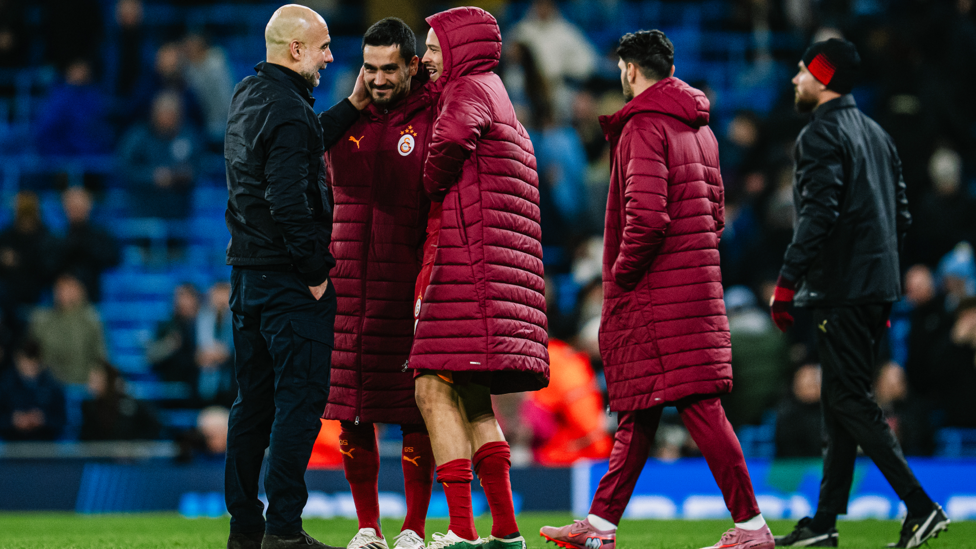FORMER BLUES : Pep catches up with former City favourites Ilkay Gundogan and Leroy Sane after the game.