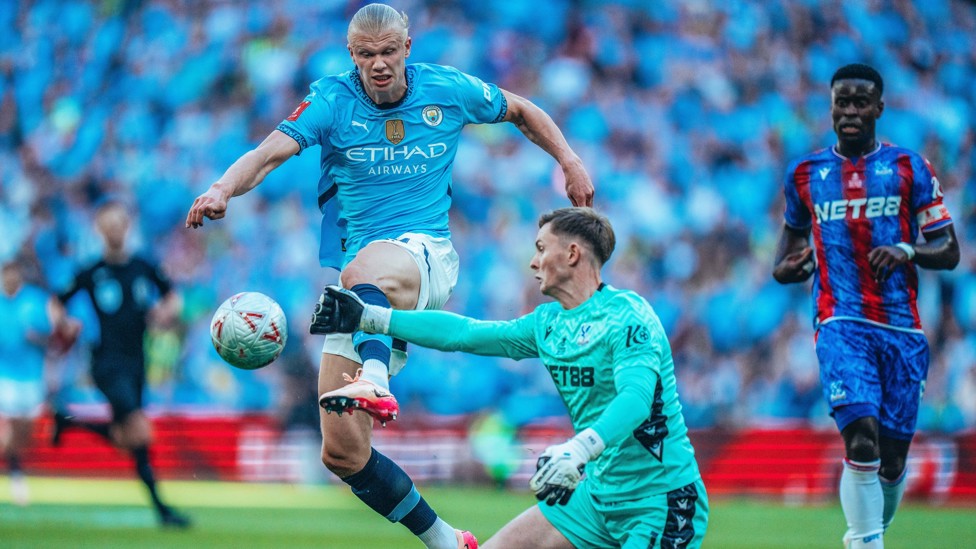 FLASHPOINT: Dean Henderson palms the ball away from Erling Haaland. 
