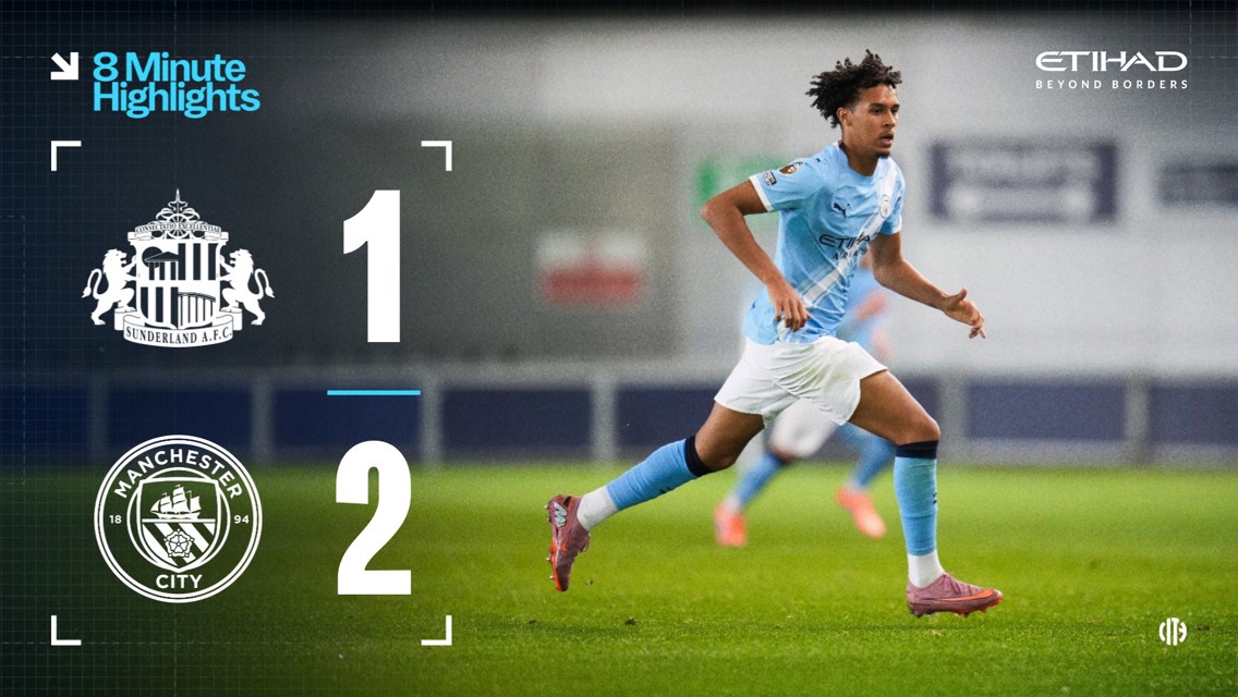 Sunderland AFC logo displayed next to a Manchester City logo showing a final score of 1-2 with a blurred image of a Manchester City player in motion. Brand names and logos are visible in the background.