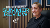 A person smiling in an office setting with text 'Therese Sjögran Summer Review' and 'Manchester City Women' logo.