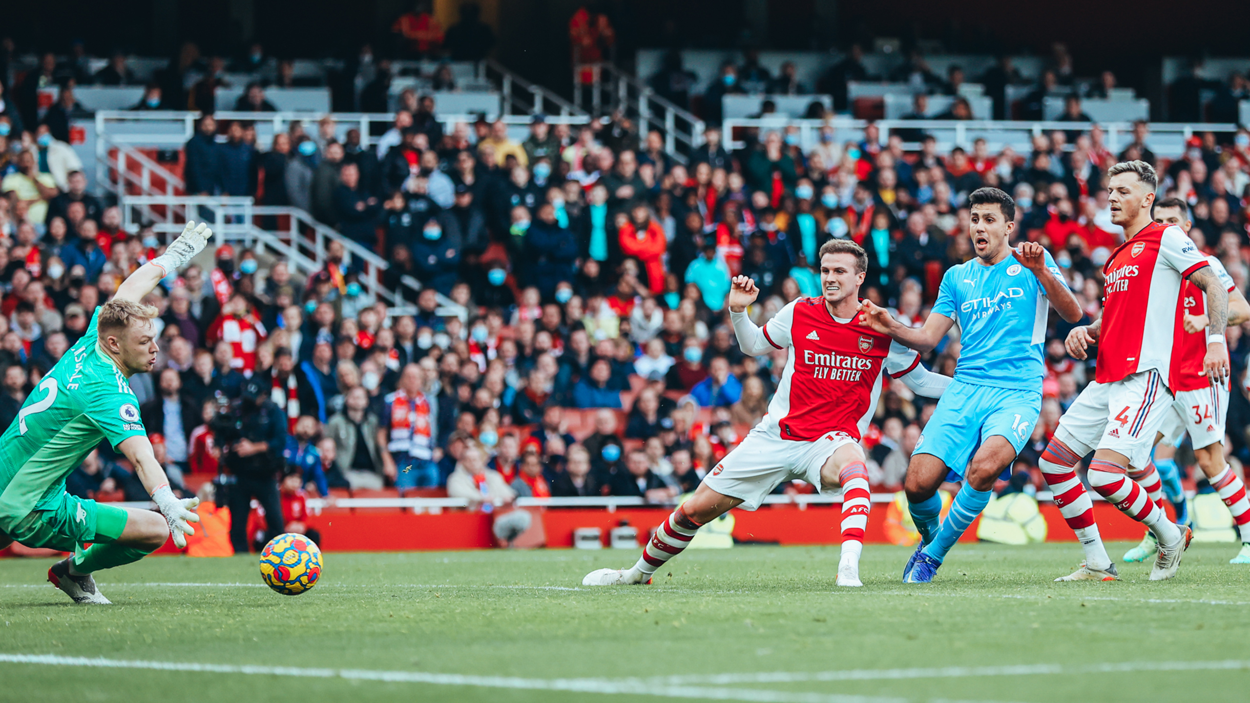 Late Rodrigo goal wins lively Arsenal clash