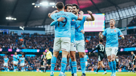 FEELING THE LOVE: Alvarez celebrates with his teammates.