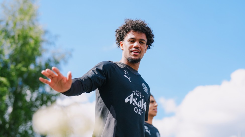 BOBBING ALONG  : Oscar Bobb makes his way onto the training pitch.