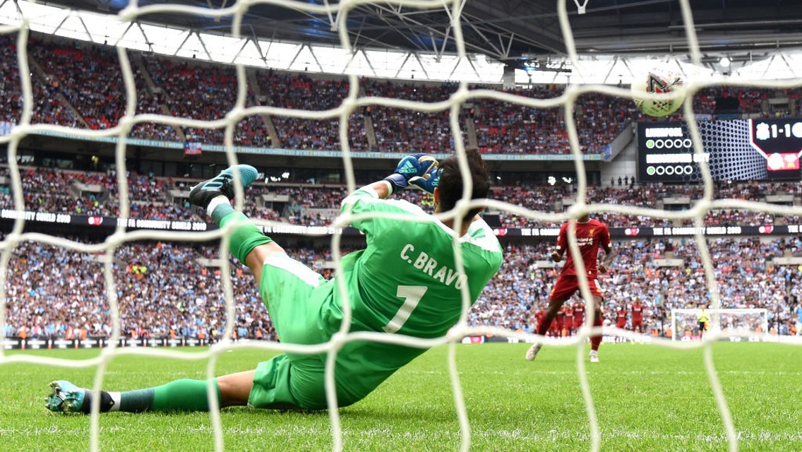 KEY MAN: Claudio Bravo denies Gini Wijnaldum from the spot.