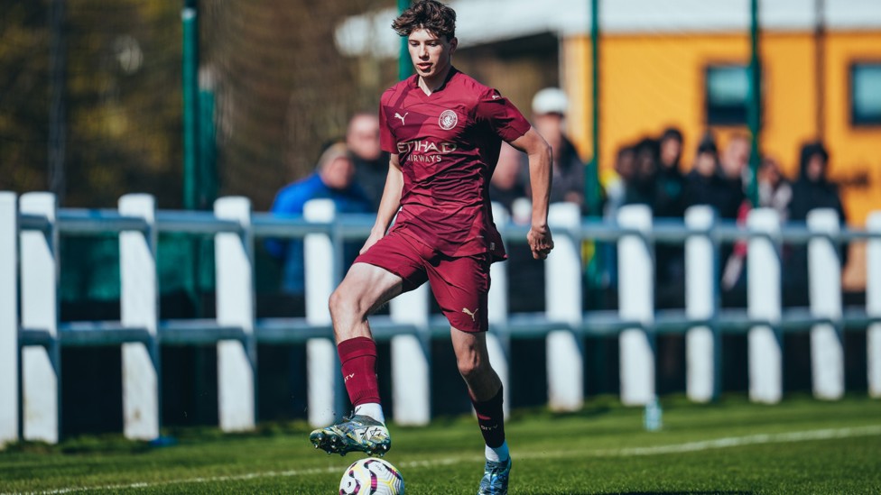 DRIVING FORWARD : Charlie Courtman charges down the right wing.