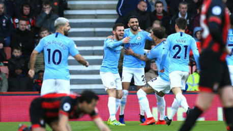 BLUE HEAVEN: Riyad Mahrez celebrates with his City team-mates after his crucial goal