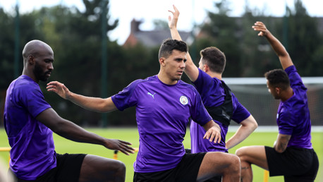 STRETCHES: Rodri alongside Eliaquim Mangala