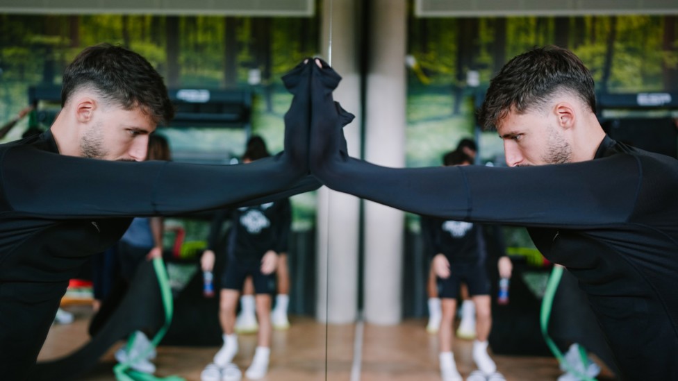 DOUBLE TAKE: Ruben Dias is captured in reflection during Friday's recovery session.