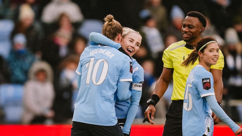 DOUBLE TROUBLE : Vivianne Miedema celebrates making it 2-0 with Alex Greenwood and Yui Hasegawa