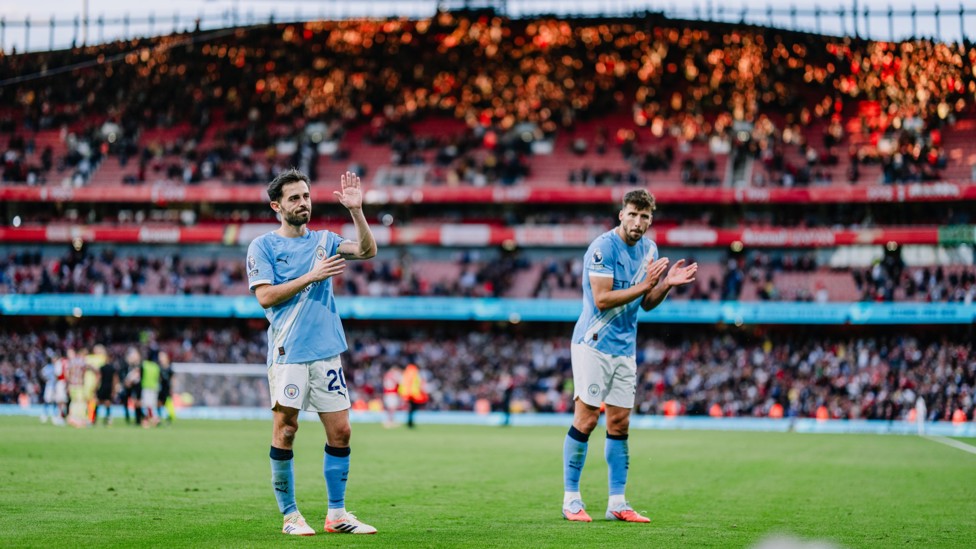 INCREDIBLE SUPPORT: Bernardo Silva and Ruben Dias applaud the fans