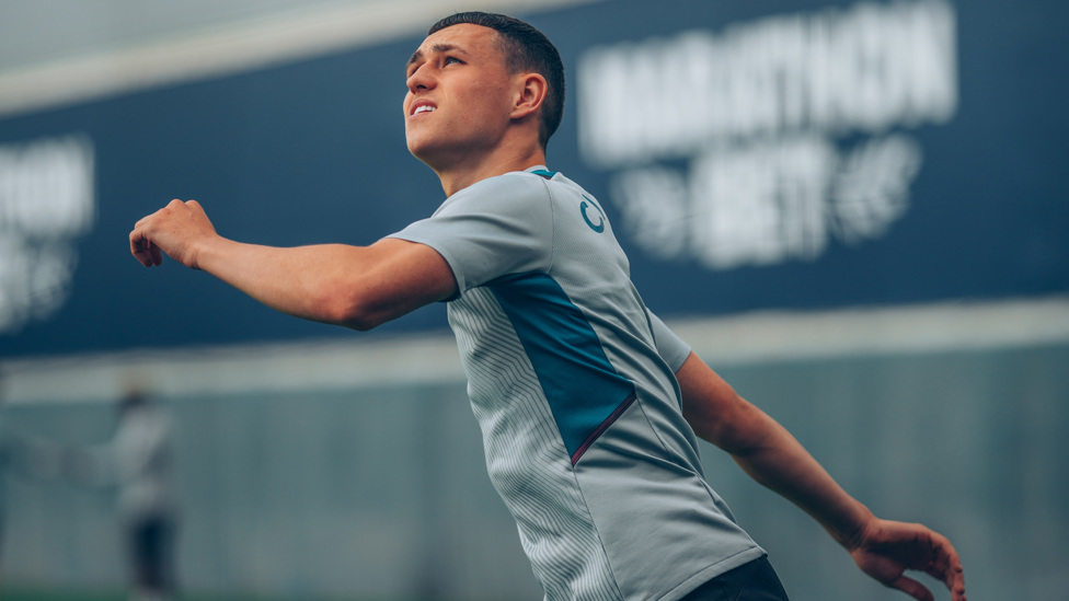 AT ARMS LENGTH: Phil Foden limbers up ahead of Saturday's assignment
