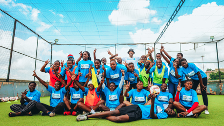 Lescott celebrates with Xylem Water Heroes Academy winners in Nairobi
