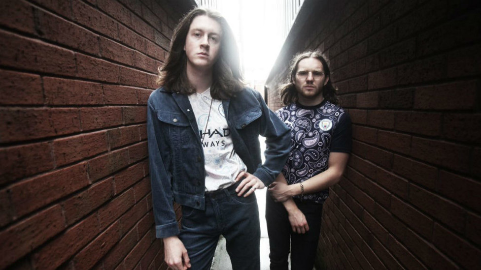 SMASH HIT: Tom and drummer Joe Donovan both approve of our distinctive new shirt