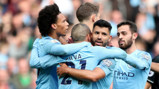 GIVE US A HUG: Sergio celebrates with his team-mates after his early strike