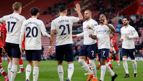 SHARE THE LOVE: The players rush to celebrate the opener with Sterling.