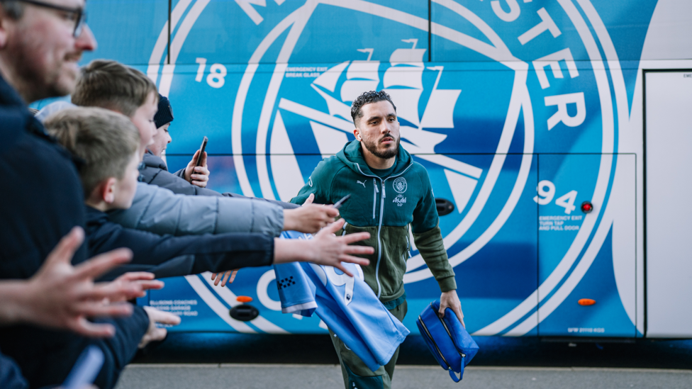 CHERK HIM OUT : All attention on our playmaker as he makes his way into the stadium.