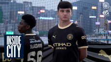 Two men in Manchester City jerseys stand outdoors with a cityscape in the background, marked with 'Inside City.'