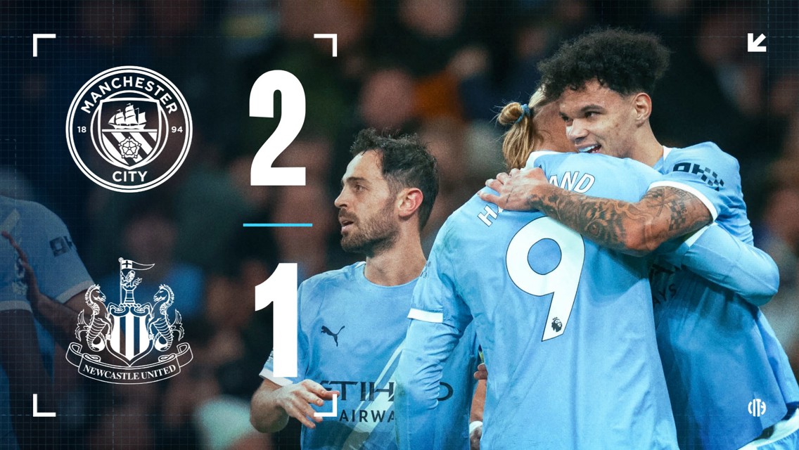 Final score overlay for Manchester City vs Newcastle United, with a 2-1 victory for Manchester City. Players are celebrating, wearing sky blue jerseys.