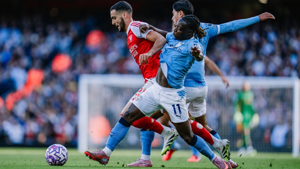 BATTLING IT OUT: Jeremy Doku looks to win the ball back