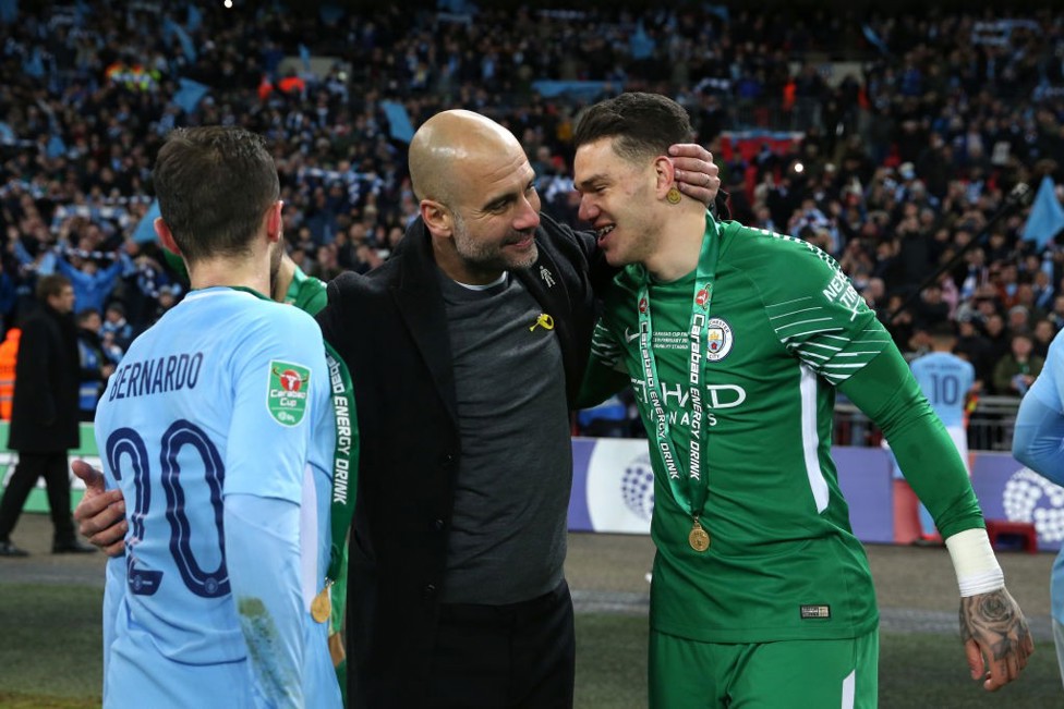 PRIZE GUY: Ederson celebrates with Pep Guardiola after our 2018 Carabao Cup final victory over Arsenal