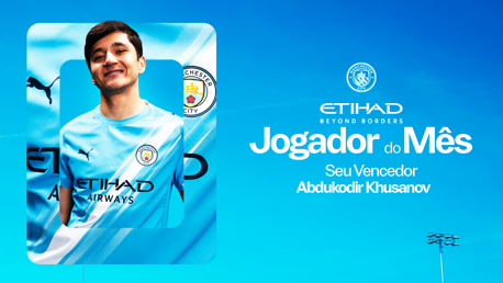 Graphic for Manchester City's Player of the Month congratulating Abdukodir Khusanov. It features the club's crest, sponsor details, and tagline 'Beyond Borders'.