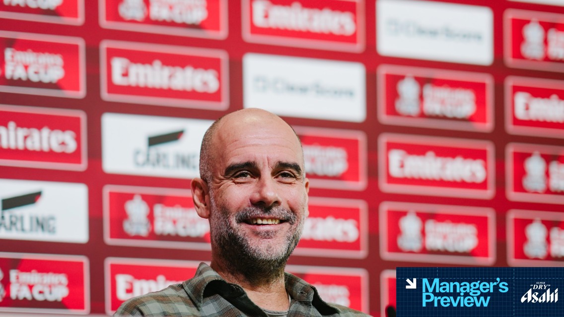 A person sitting at a press conference with Emirates FA Cup branding on the backdrop. The text 'Manager's Preview' is visible, along with logos for Asahi and Carling.