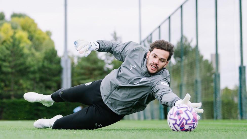 FULL STRETCH : Ederson reaches for a shot