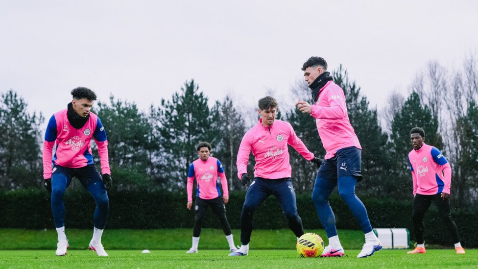 ALL TOGETHER NOW: Nico O'Reilly, John Stones and Phil Foden in the thick of things.