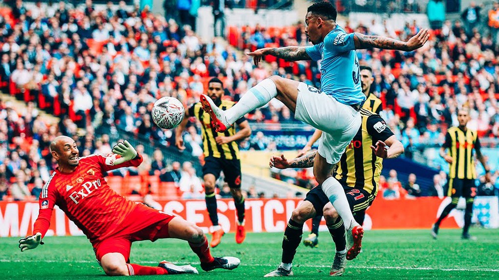 GIFT OF THE GAB : Gabriel Jesus pokes the ball past Gomes