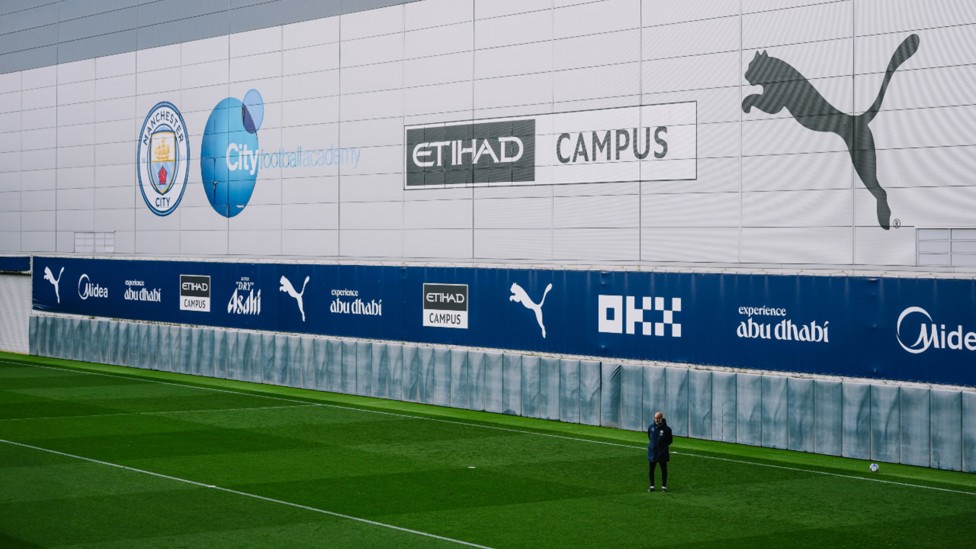 SCENE SETTER: Pep Guardiola is framed by the CFA backdrop.